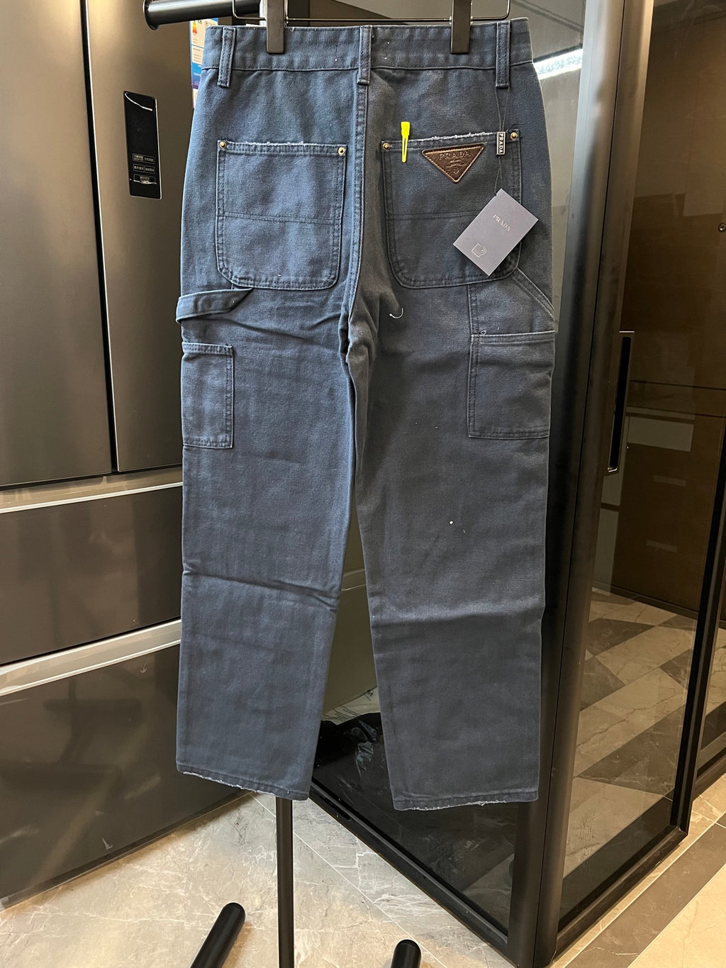 Prada denim cargo pants, light blue, patch pockets, brown leather-trimmed logo patch