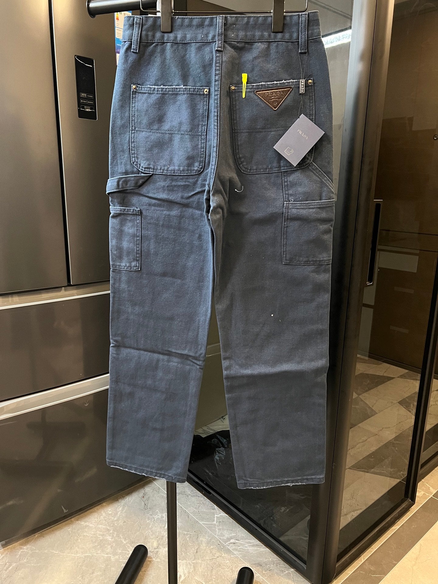 Prada denim cargo pants, light blue, patch pockets, brown leather-trimmed logo patch