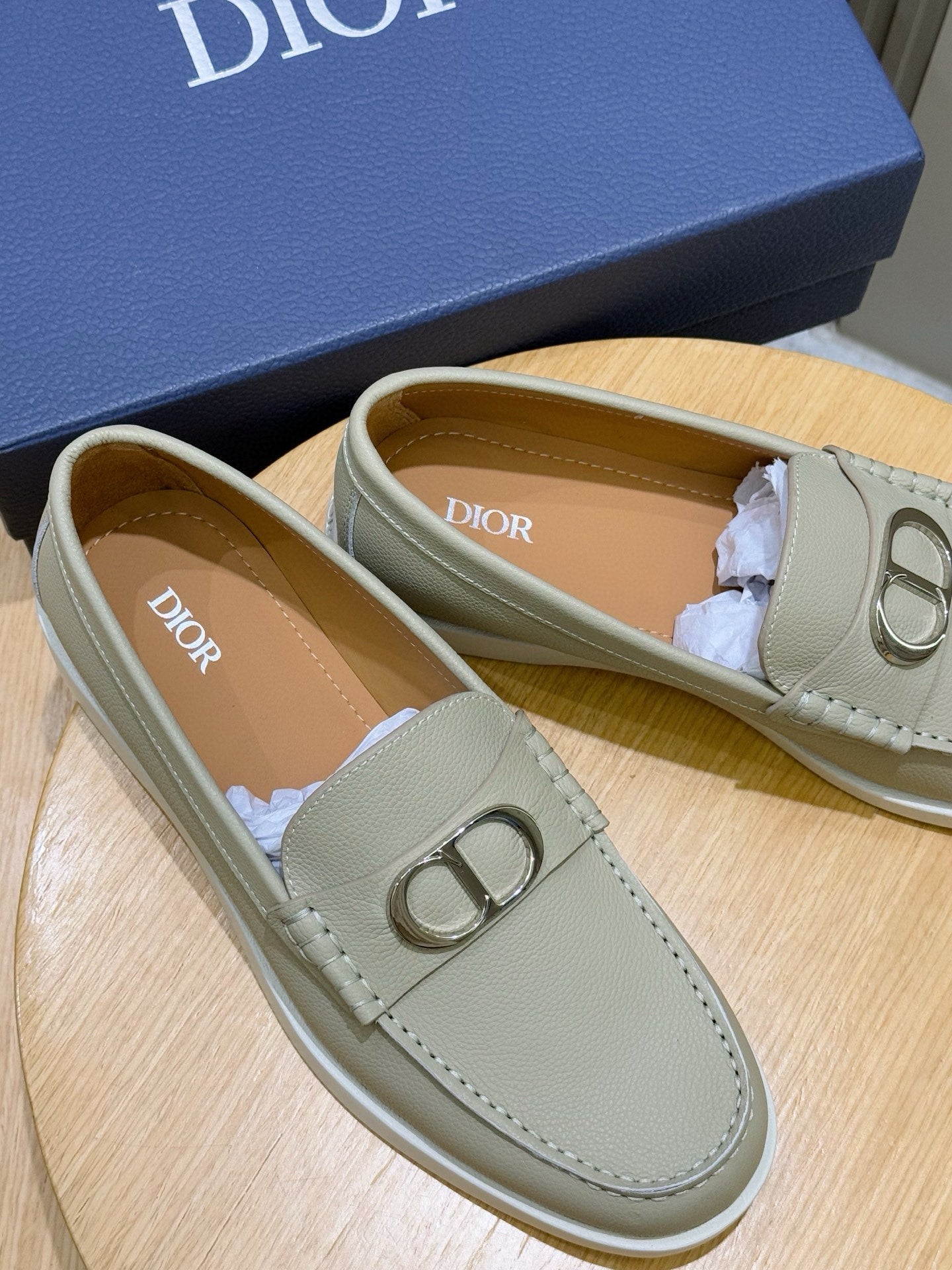 Beige loafer interior with Dior logo and silver-tone D buckle