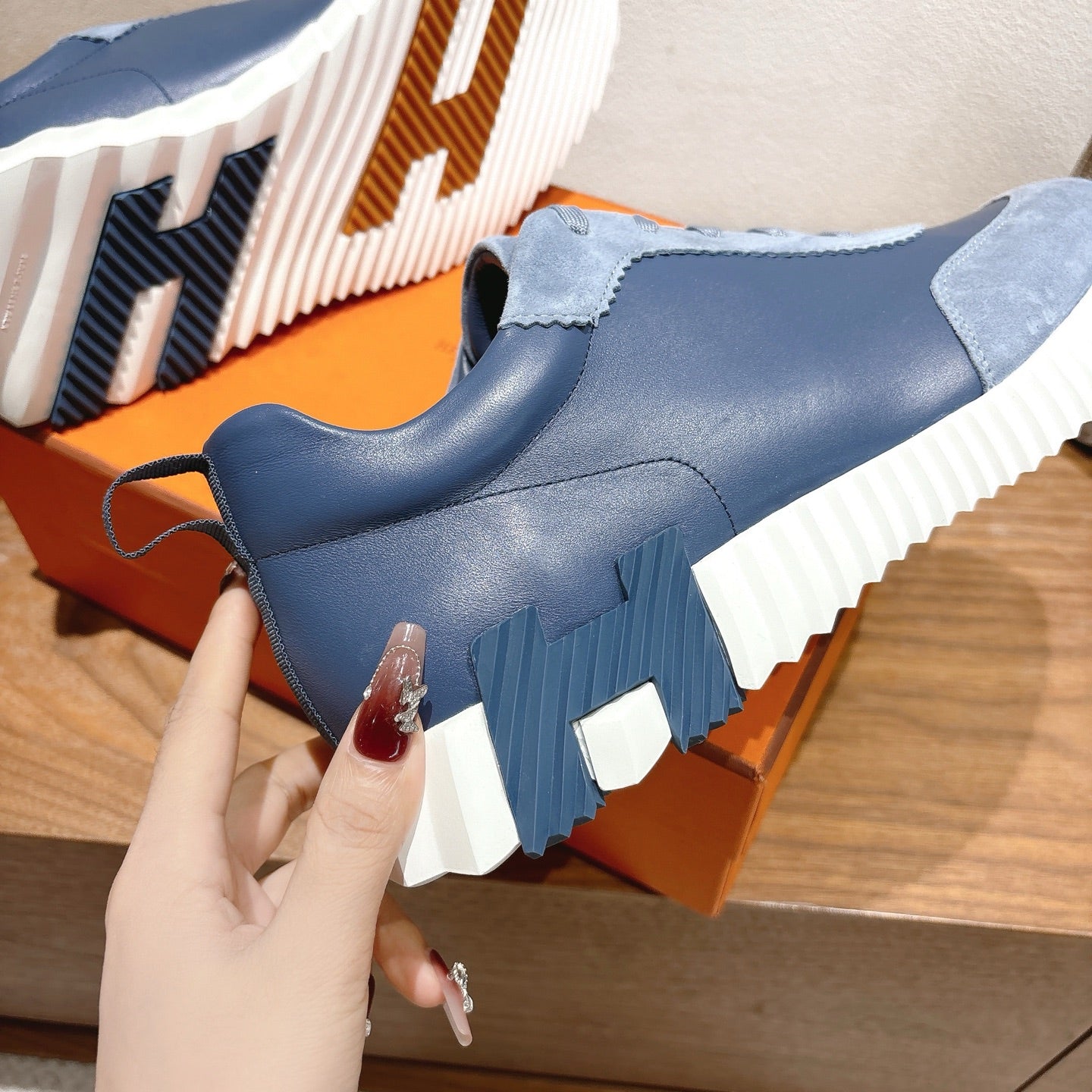 Unisex light-blue sneaker side view with thick white sole and lace-up design