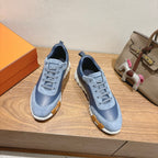 Unisex light-blue lace-up sneakers with scalloped stitching and white rubber sole