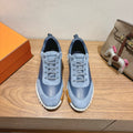 Unisex light-blue sneakers with lace-up front, suede-look upper, white tread sole