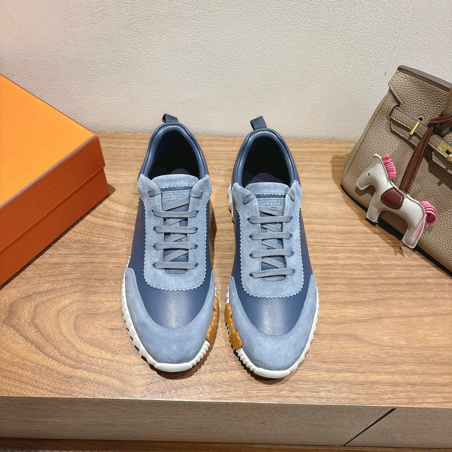 Unisex light-blue sneakers with lace-up front, suede-look upper, white tread sole
