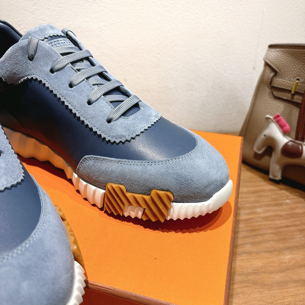 Unisex light-blue sneaker close-up with lace-up upper and ridged sole