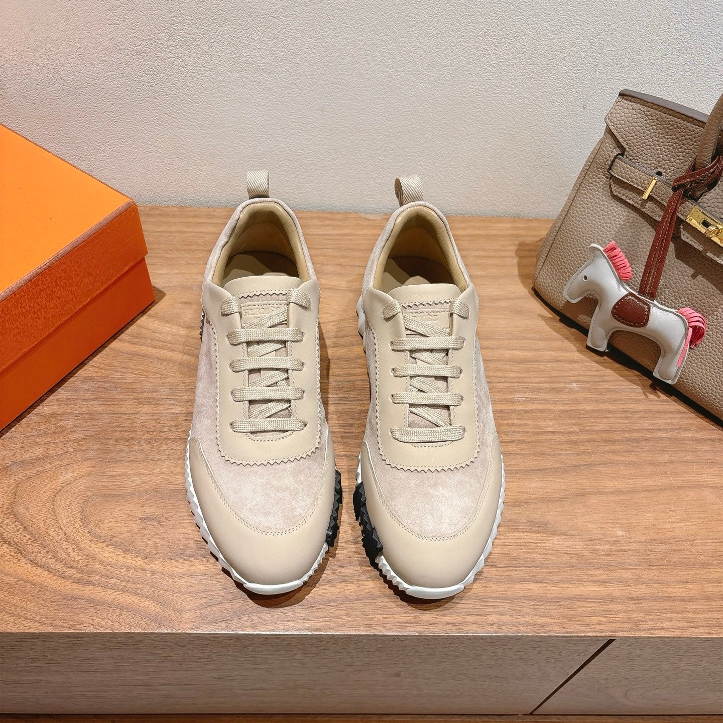 Cream suede lace-up sneakers with padded collar and chunky white sole, pair view