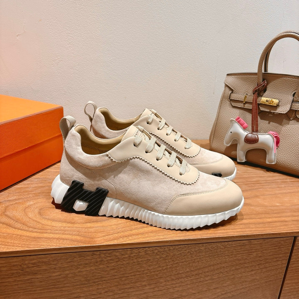 Cream suede lace-up sneakers with black-and-white molded sole, side angle