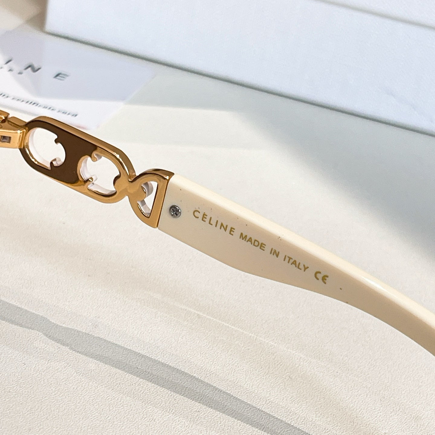 Celine sunglasses side view: gold hinges and Celine made in Italy text on arm
