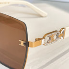 Celine sunglasses close-up: gold temple with crystal-studded logo detail
