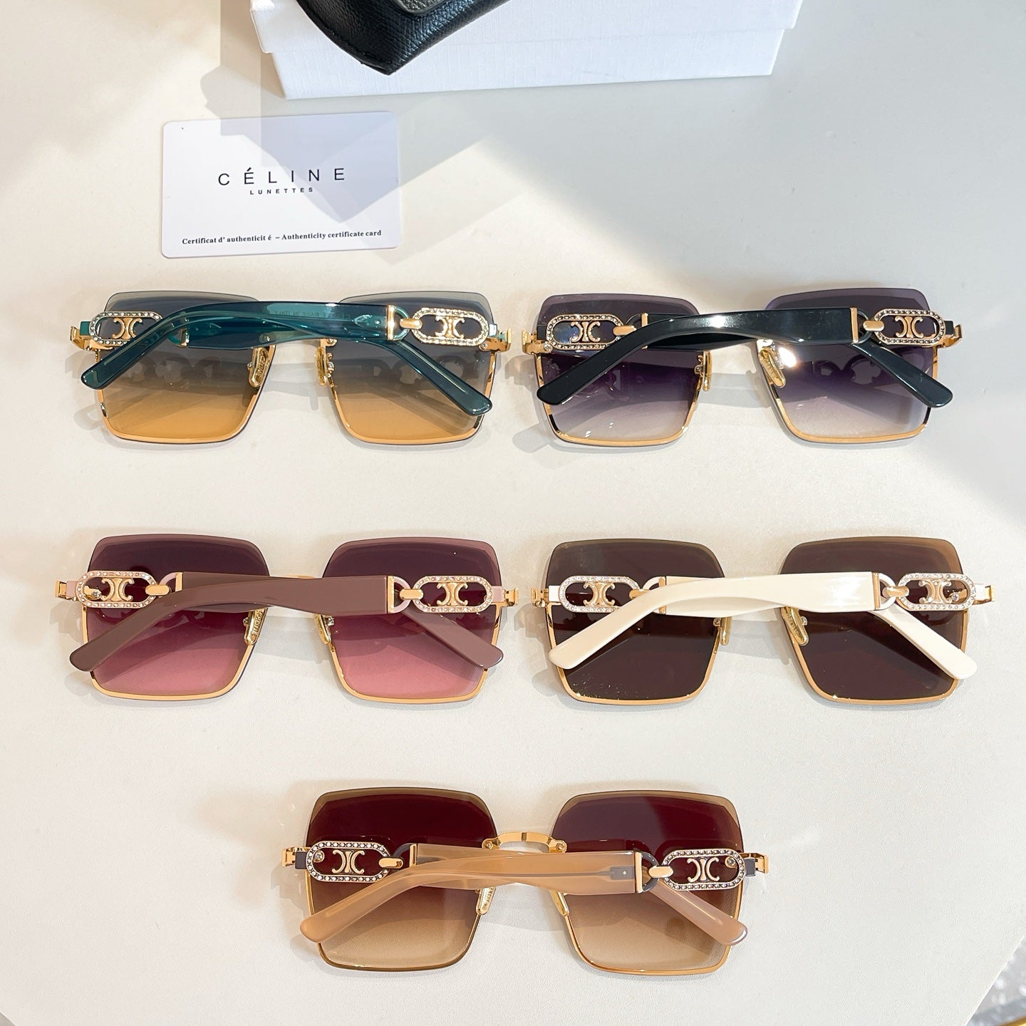 Assorted Celine sunglasses lineup with teal, burgundy, brown and black frames