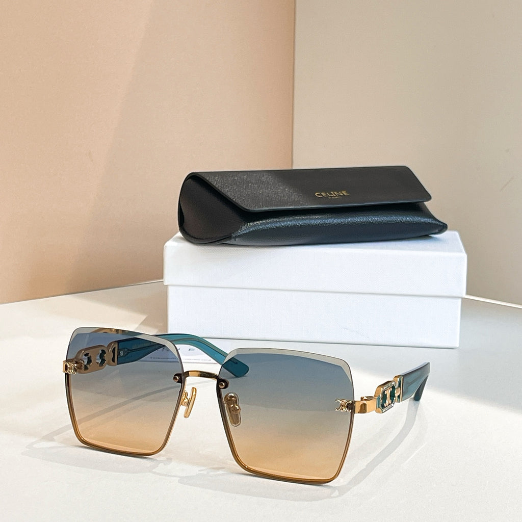 Celine sunglasses with teal-tinted frames and amber lenses, gold chain-link temple