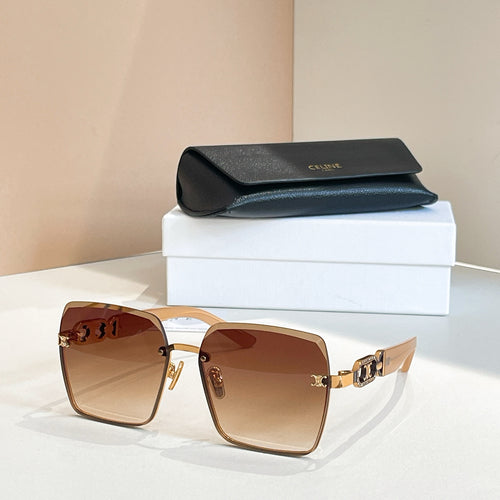Celine sunglasses with tan frames and amber lenses, gold link-style temple detail