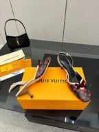 Women’s slingback flats at angle, cherry print with burgundy bow, gold-tone hardware