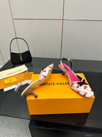 Slingback heeled shoes, white with red cherry print, fuchsia lining, and curved heel.