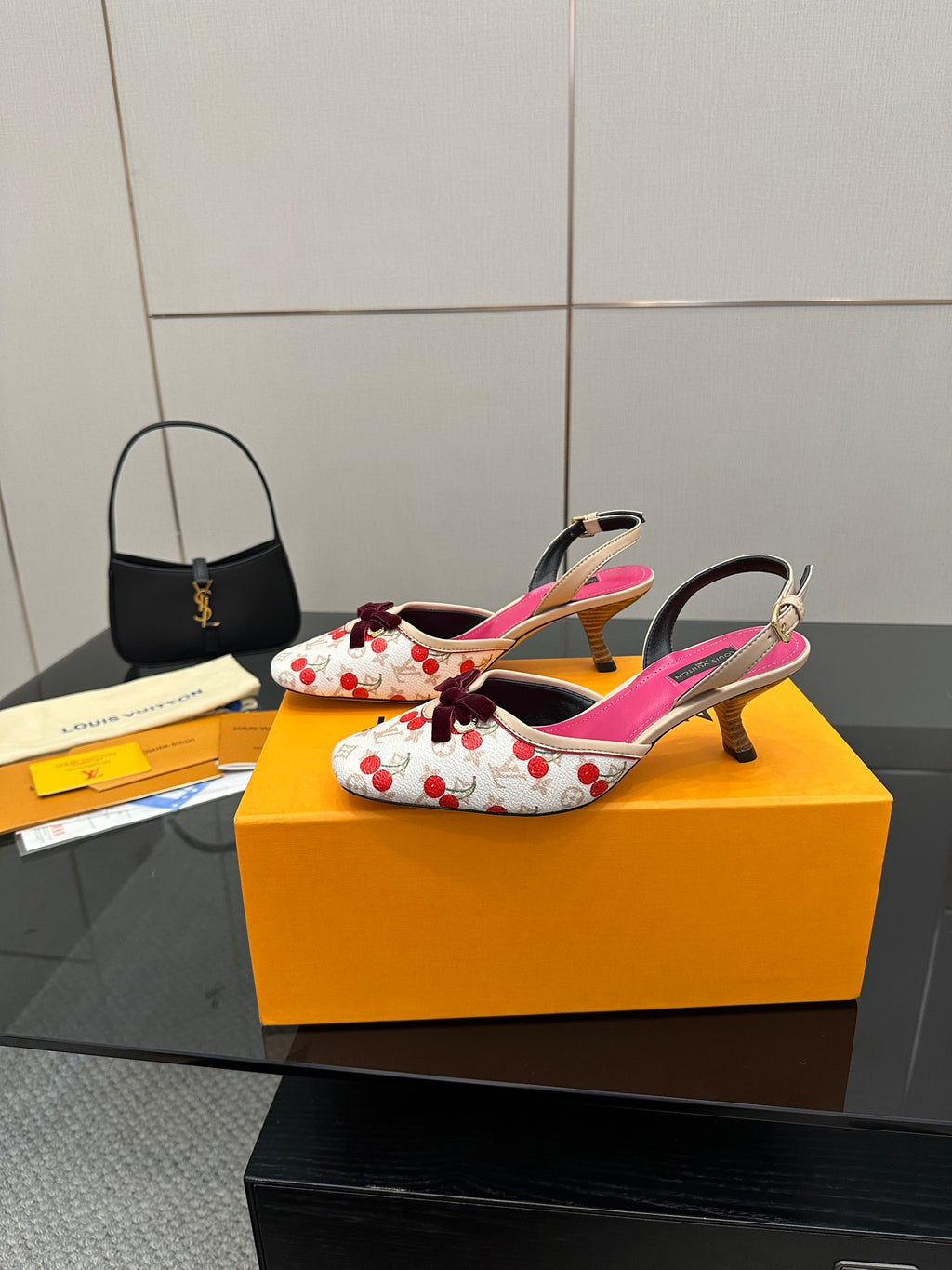 Heeled slingback shoes, white cherry print with bow, fuchsia straps, and mid heels.