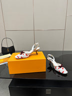 Women's slingback shoes with red cherries, white ankle straps, and block heel