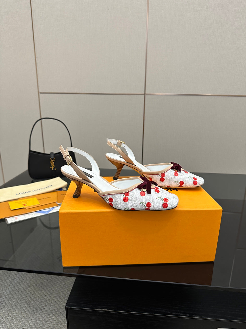 Women's slingback shoes with white uppers, red cherries, and small heel