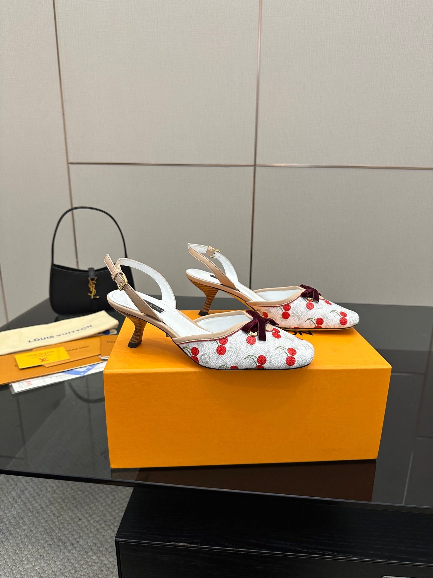Women's slingback shoes with white uppers, red cherries, and small heel