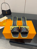 Louis Vuitton slide sandals with multicolor monogram, neon green trim, and bow strap