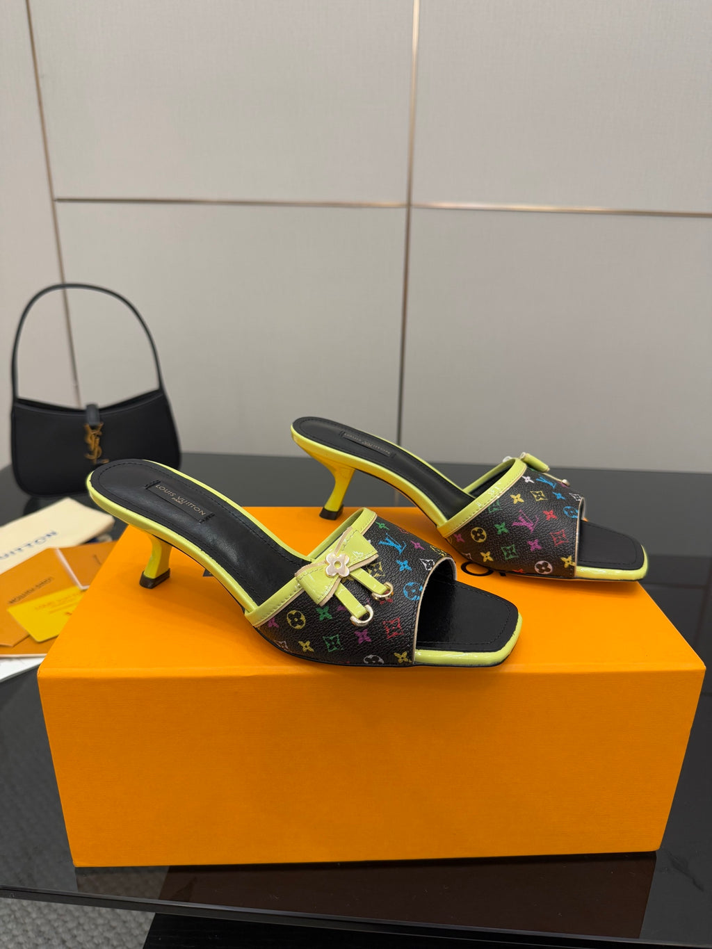 Louis Vuitton heeled slide sandals with multicolor monogram print and neon green edging