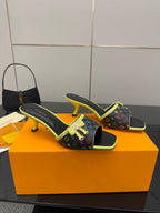 Louis Vuitton heeled slide sandals with multicolor monogram print and neon green edging