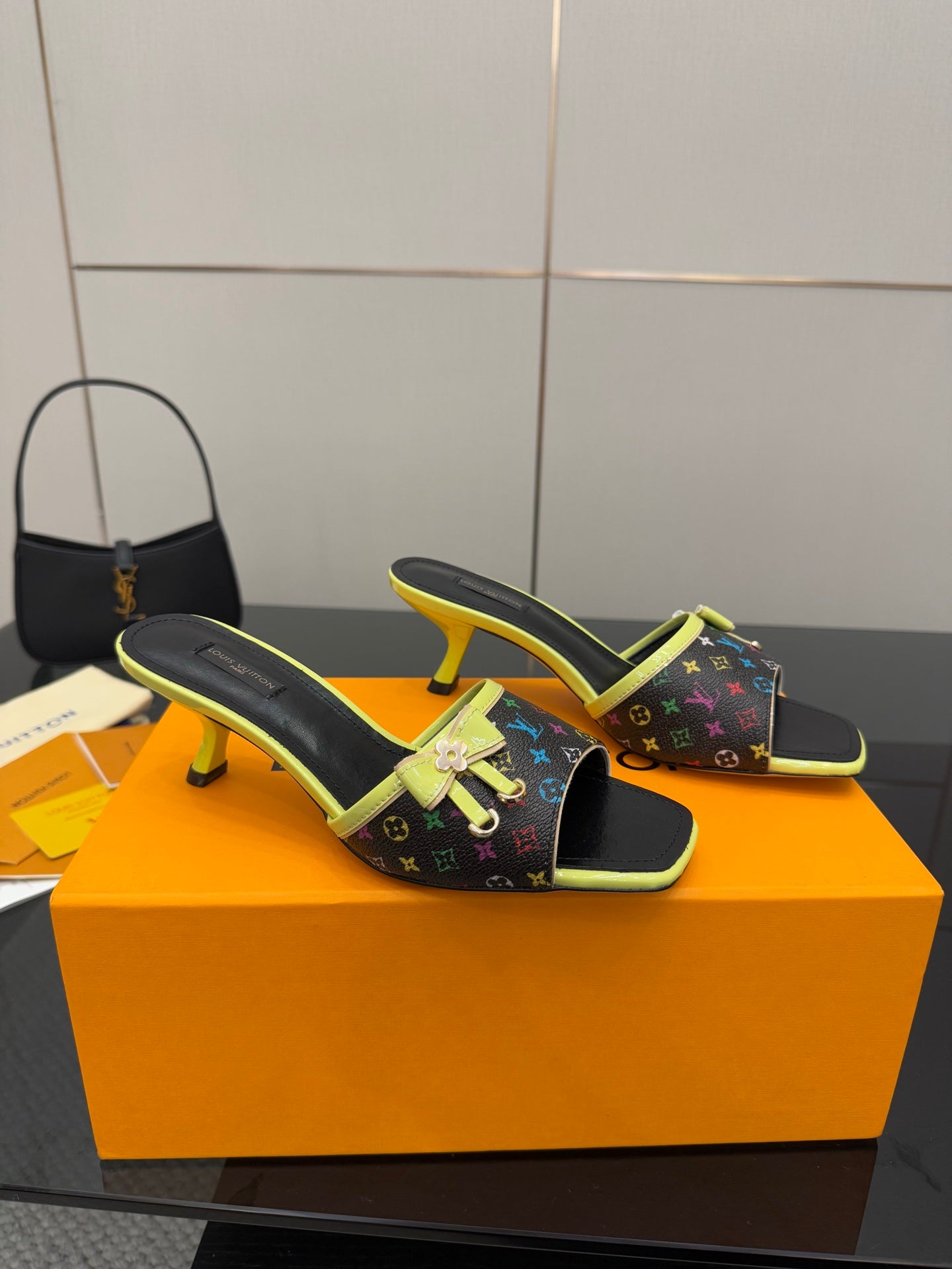 Louis Vuitton heeled slide sandals with multicolor monogram print and neon green edging