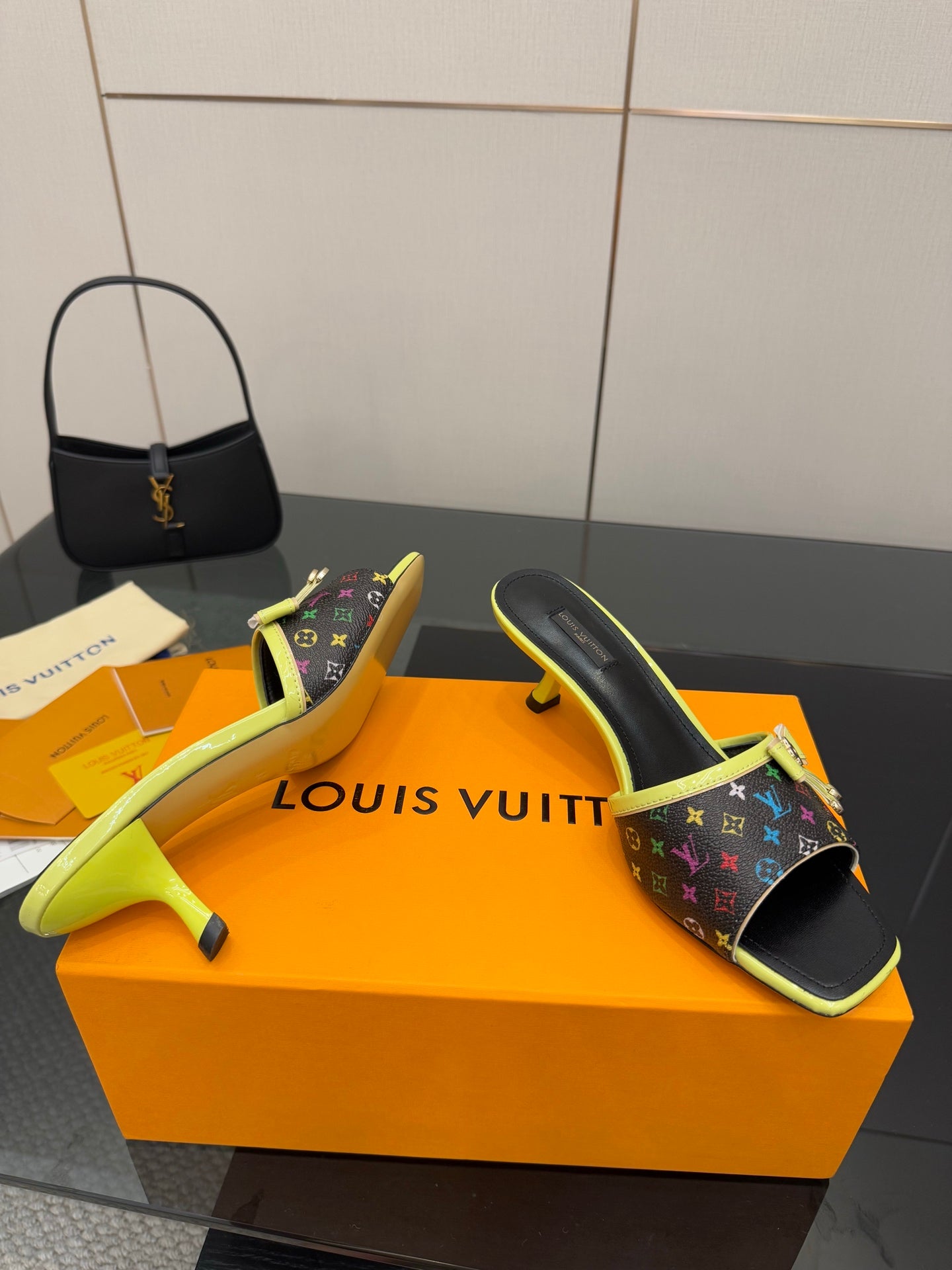 Louis Vuitton heeled slide sandals with multicolor monogram and neon green trim