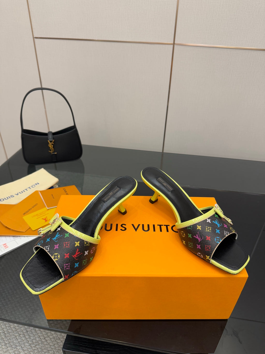 Louis Vuitton heeled slide sandals with multicolor monogram straps and neon green trim