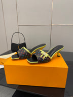Louis Vuitton heeled slide sandals with multicolor monogram and neon green trim