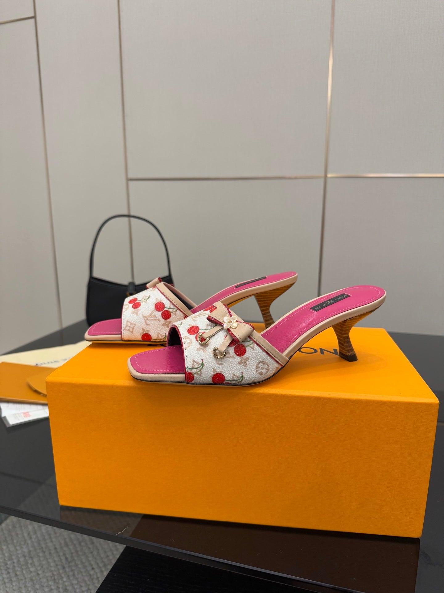 Pink and white cherry print heeled mule slides, side view