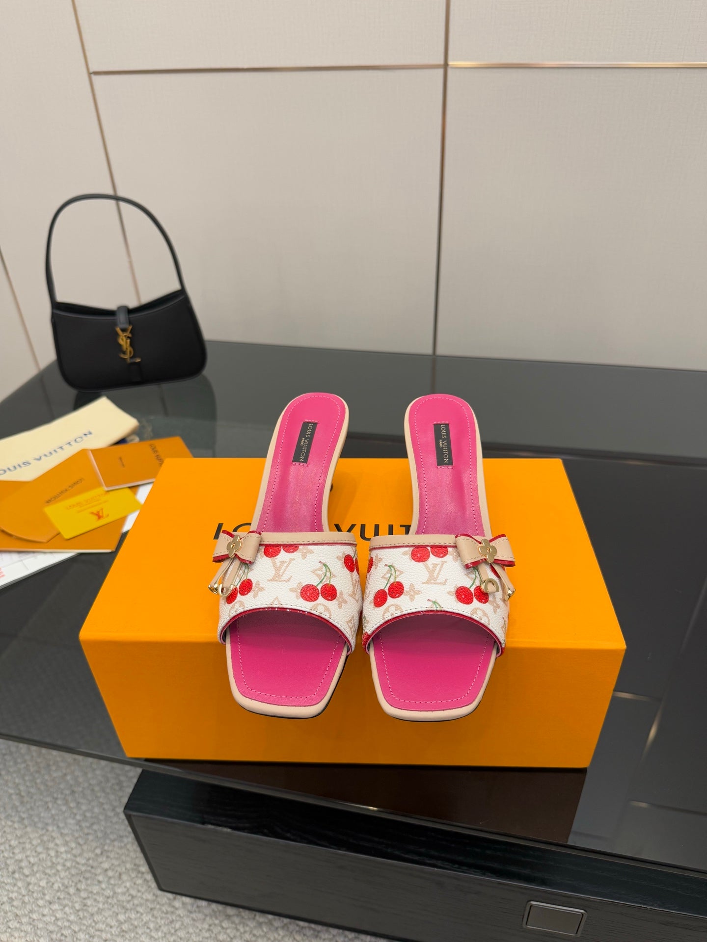 Pink and white cherry print heeled slide mules with gold tassel detail