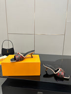 Louis Vuitton slide mule with floral monogram upper on block heel