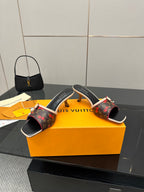 Louis Vuitton heeled slide mules with bow accent and red floral monogram upper