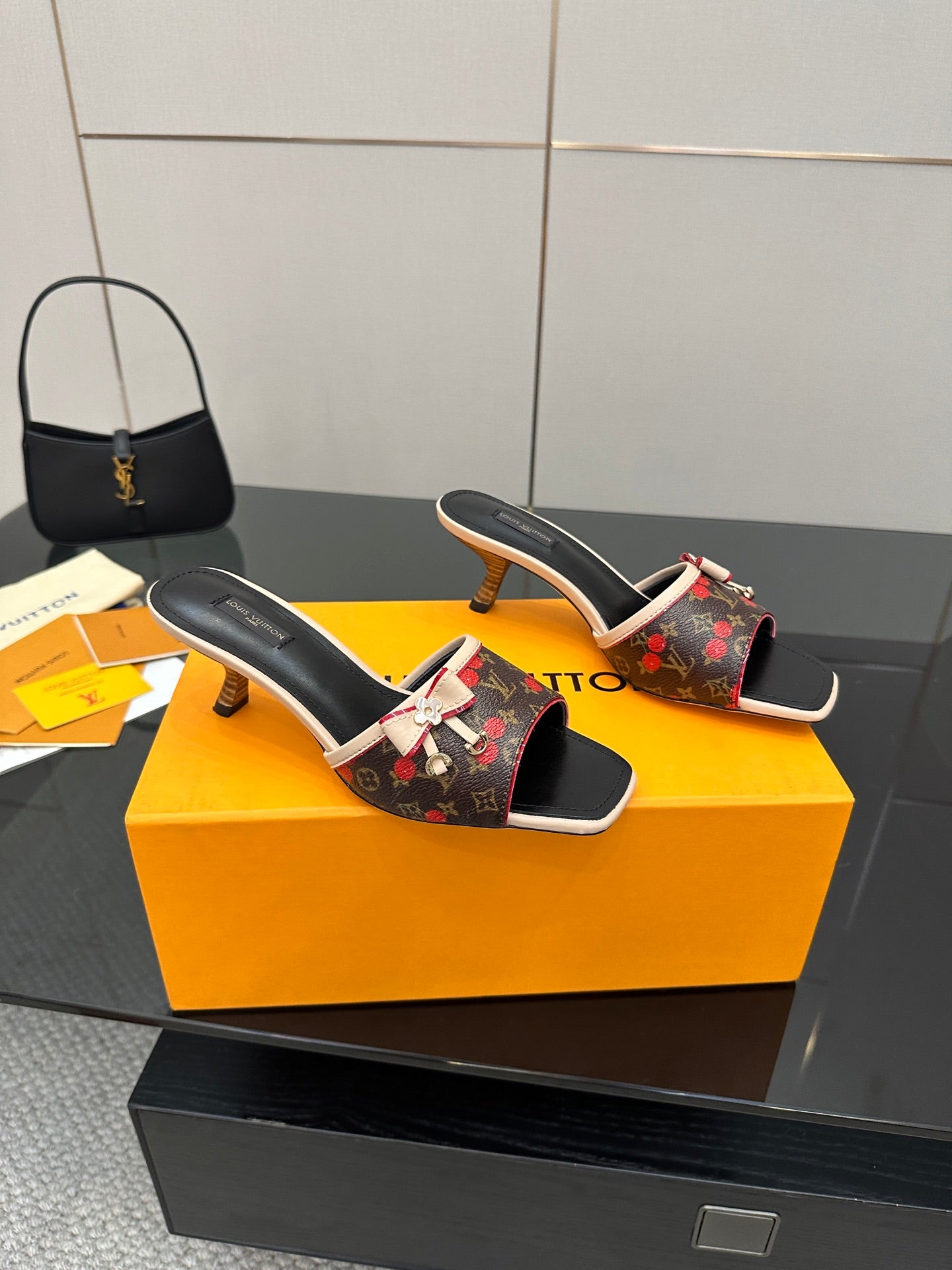 Louis Vuitton heeled slide mules, black footbed with cream trim and floral monogram upper