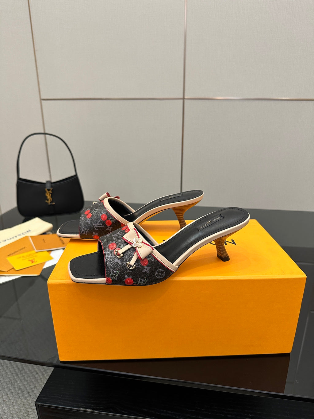 Louis Vuitton ladies slide mules with low heel, black floral print, beige edging