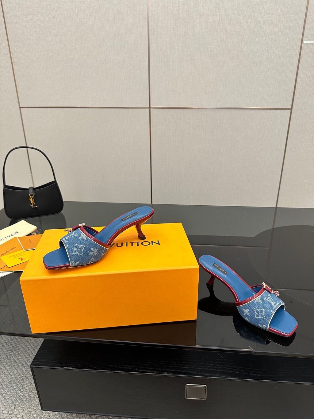 Louis Vuitton women's blue monogram heeled mule, single shoe view with red trim