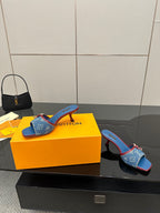 Louis Vuitton women's blue monogram heeled mule, single shoe view with red trim