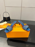 Louis Vuitton women's blue monogram heeled mules with red trim and gold-tone bow