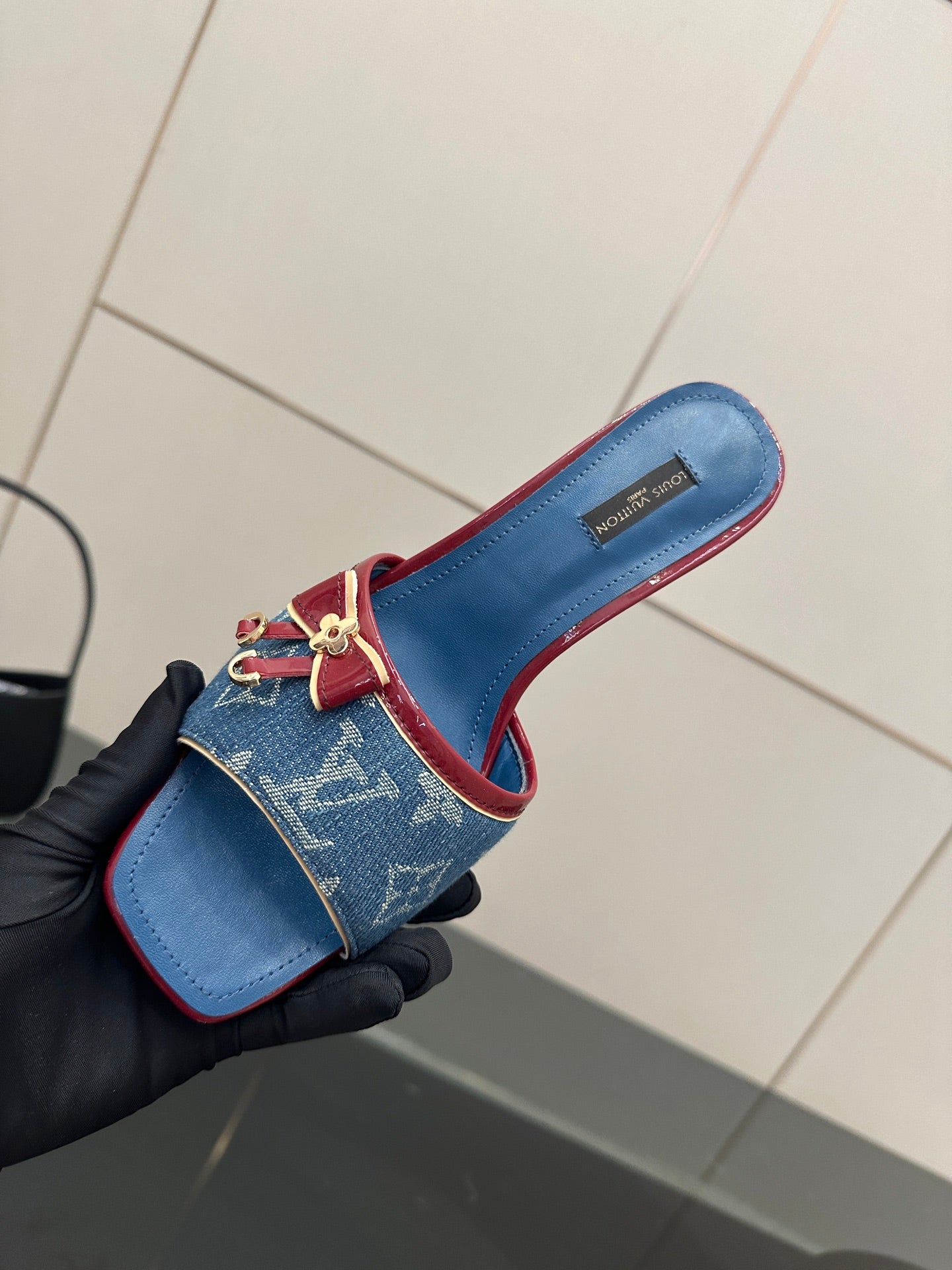 Louis Vuitton women's blue monogram slide mule with red border and bow detail