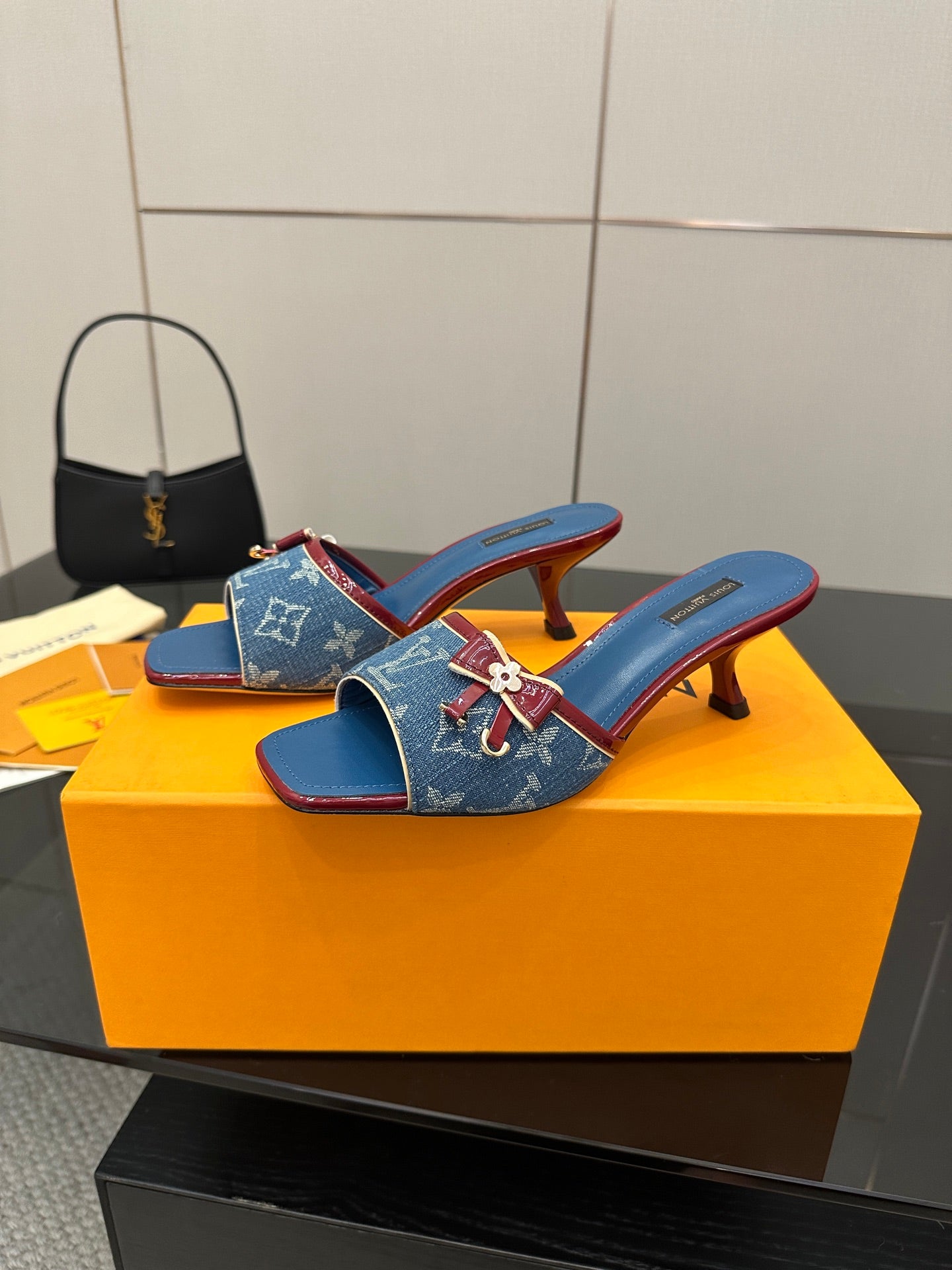 Louis Vuitton women's blue monogram slide mules with bow detail and mid heel
