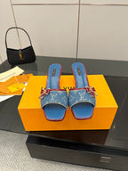 Louis Vuitton women's blue monogram heeled mules with red trim and bow hardware
