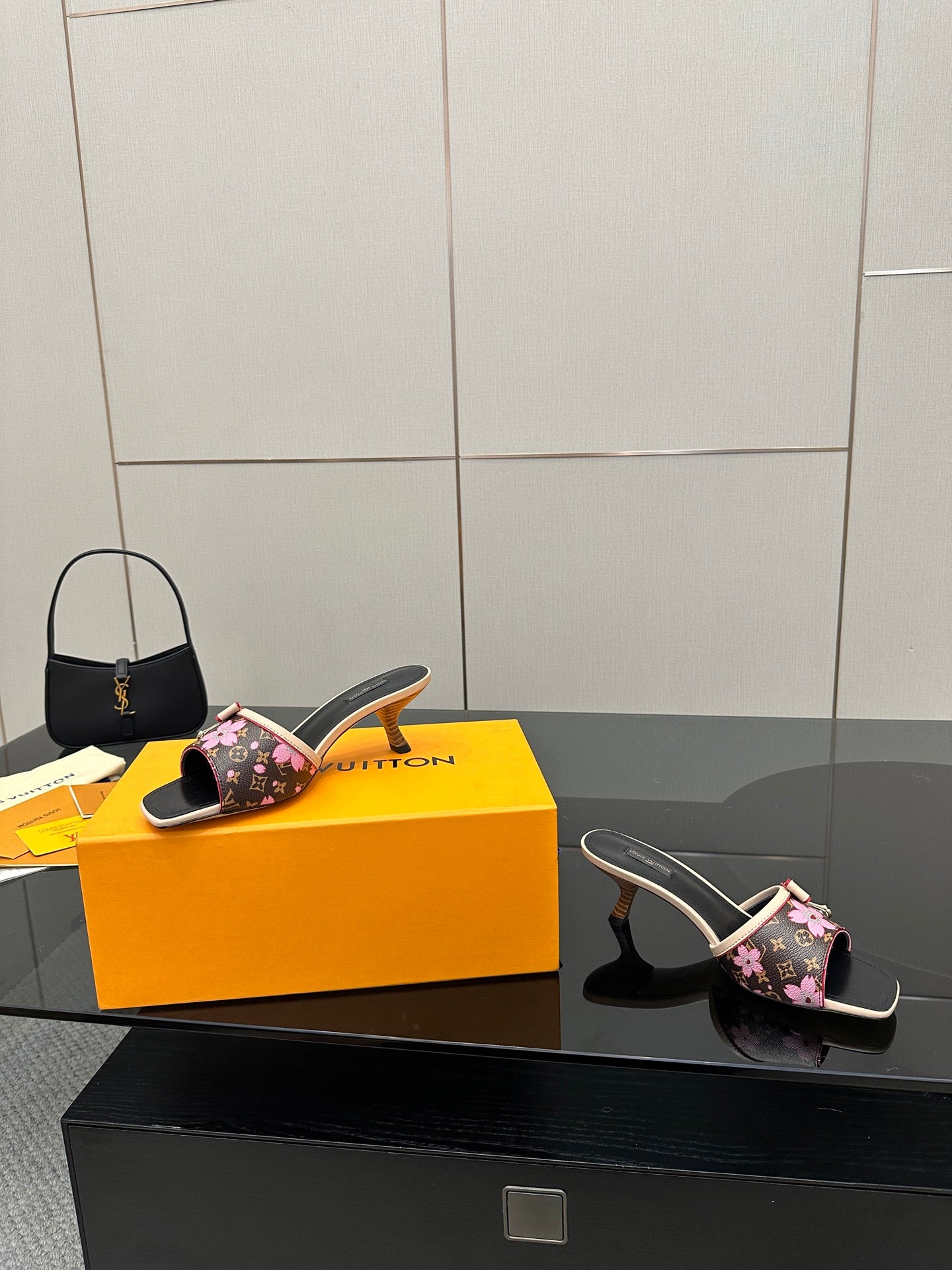 Women's heeled mules with floral straps, black leather-look slides, gold-trim heel
