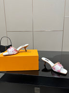 Louis Vuitton women’s floral mule shoes, side view with gold heel and white lining