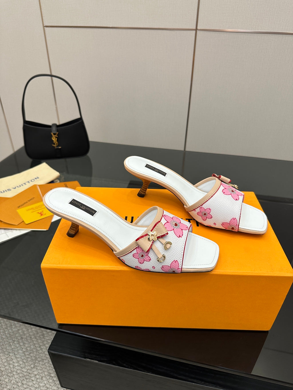 Louis Vuitton women’s mule slides with pink floral fabric, white straps, and block heel