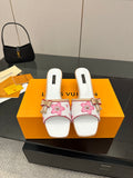 Louis Vuitton women’s mule shoes, white with pink floral print and bow detail