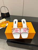 Louis Vuitton women’s mule shoes, white with pink floral print and bow detail