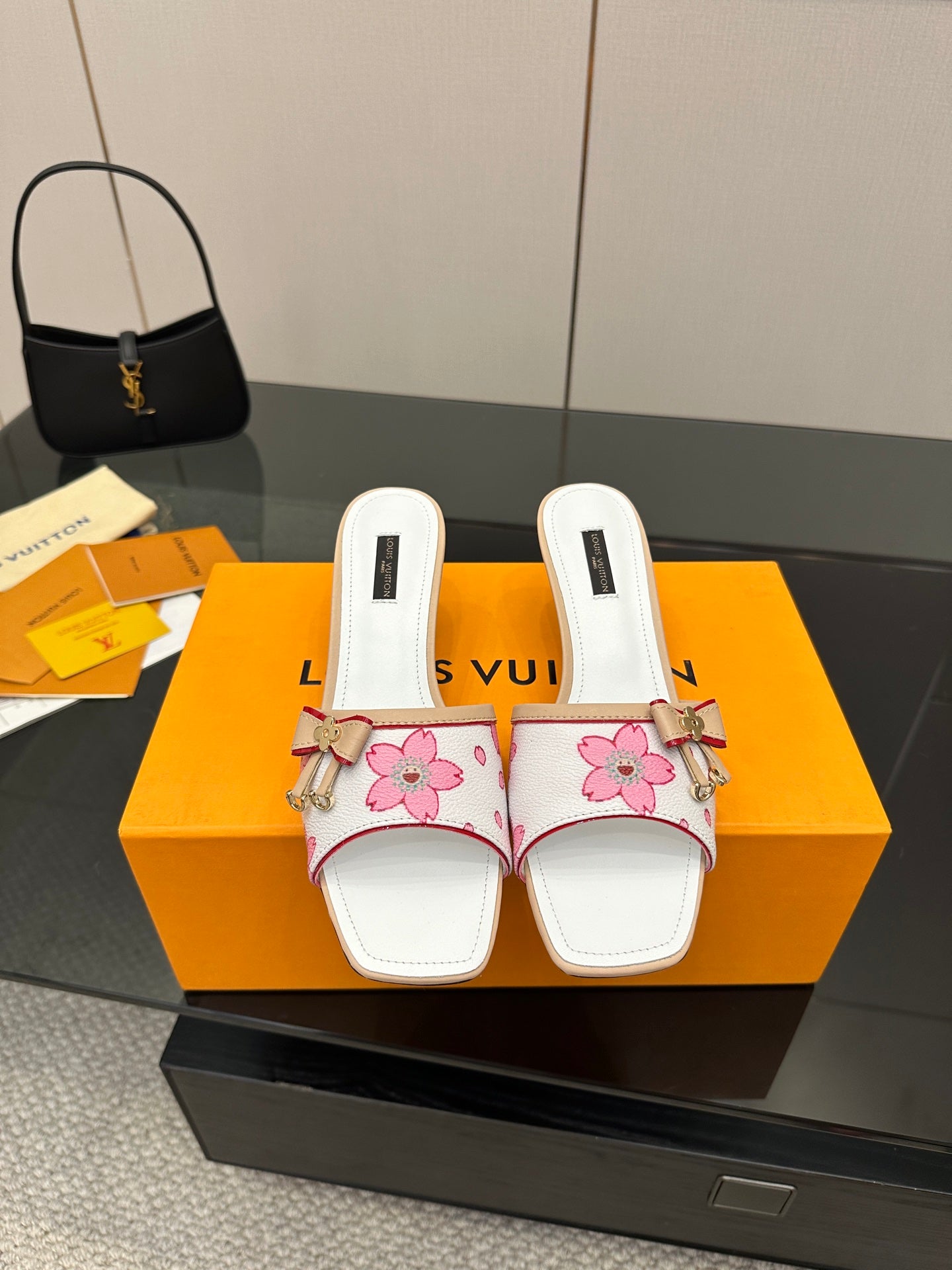 Louis Vuitton women’s mule shoes, white with pink floral print and bow detail
