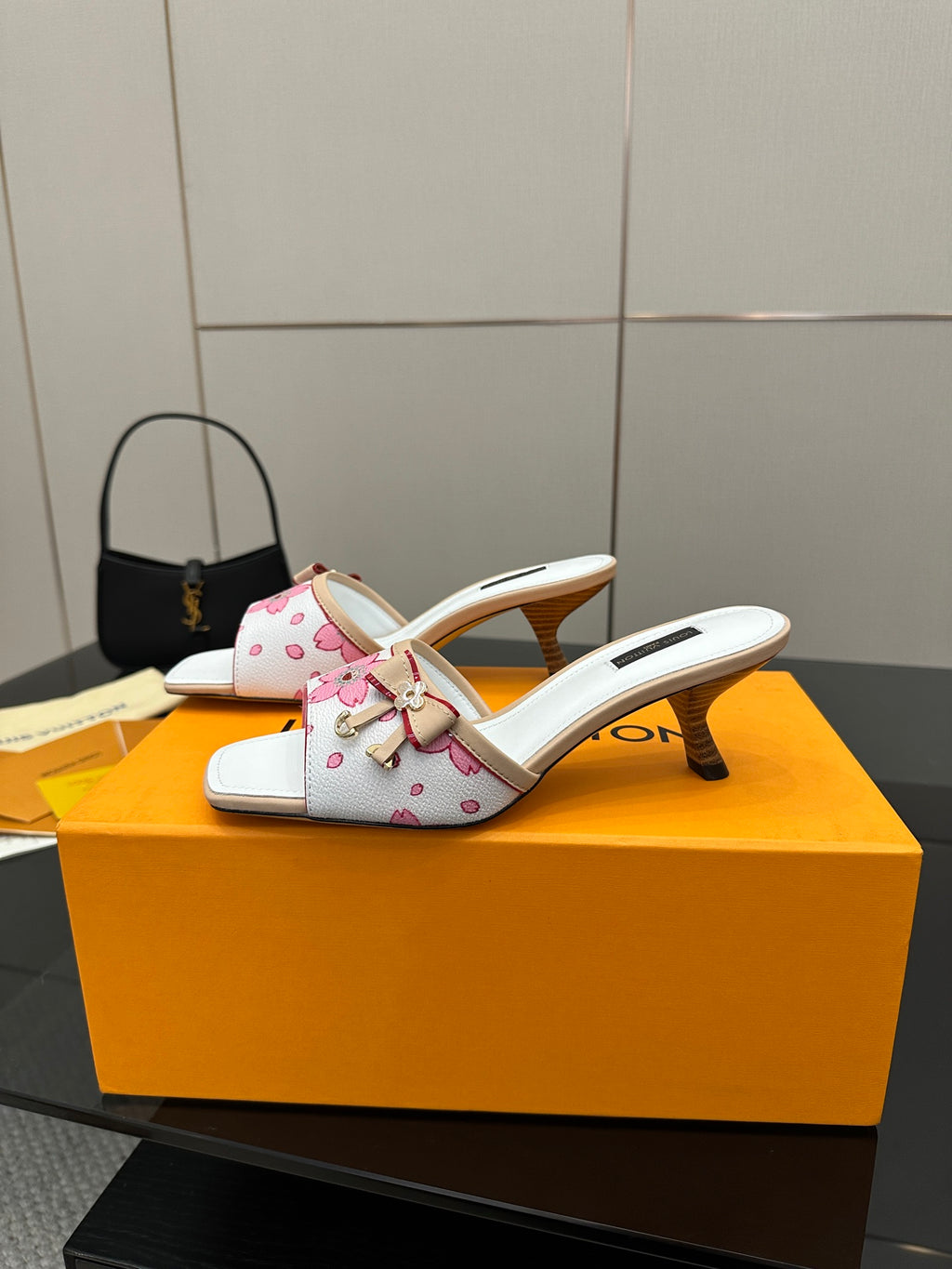 Louis Vuitton women’s floral mule slides with white upper, pink flowers, and gold heel