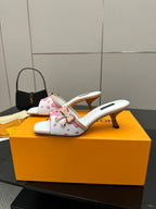 Louis Vuitton women’s floral mule slides with white upper, pink flowers, and gold heel