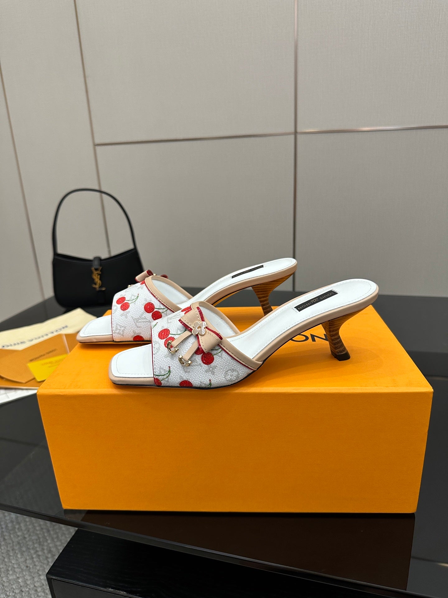 Women’s white cherry-print mules with gold-toned bow detail and mid heel