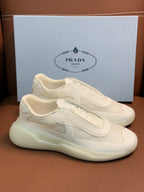 Prada unisex low-top sneakers, light cream leather, front and side profile on display